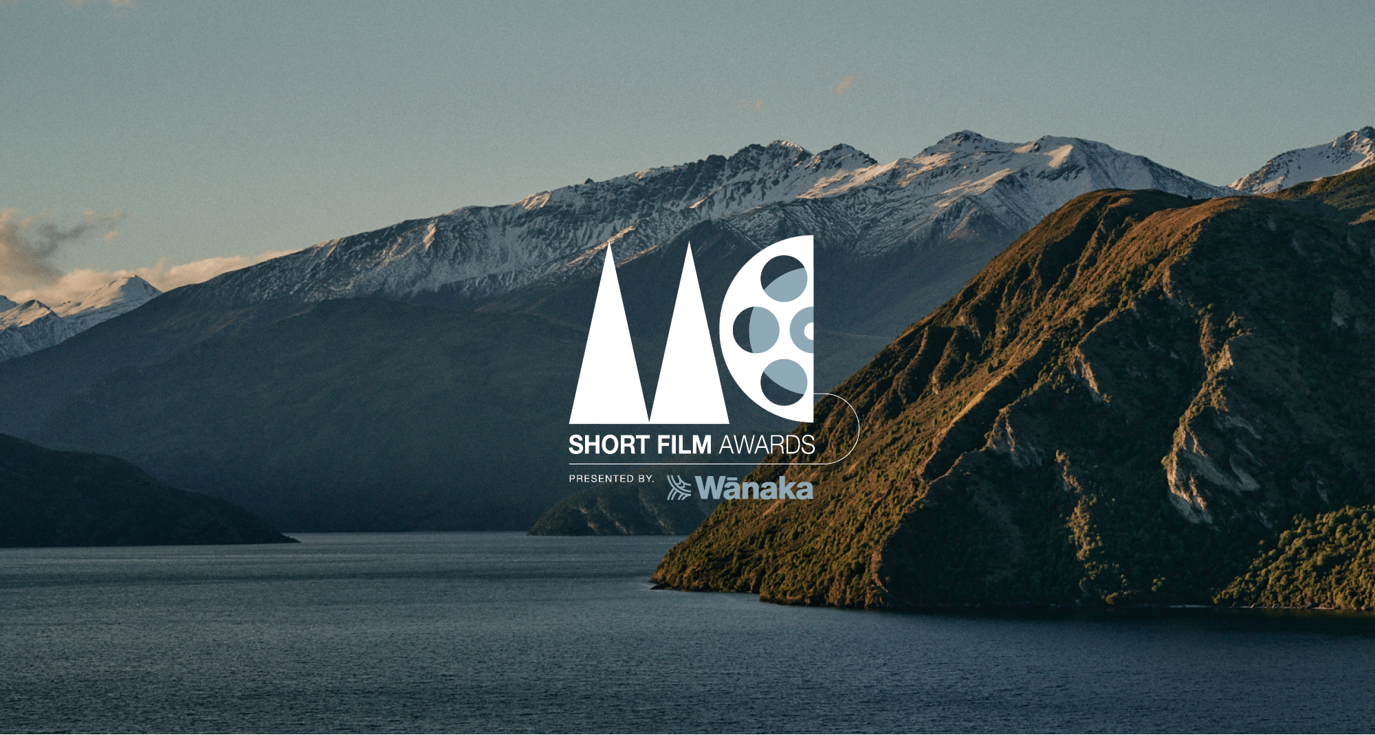 monster children logo over wanaka mountains