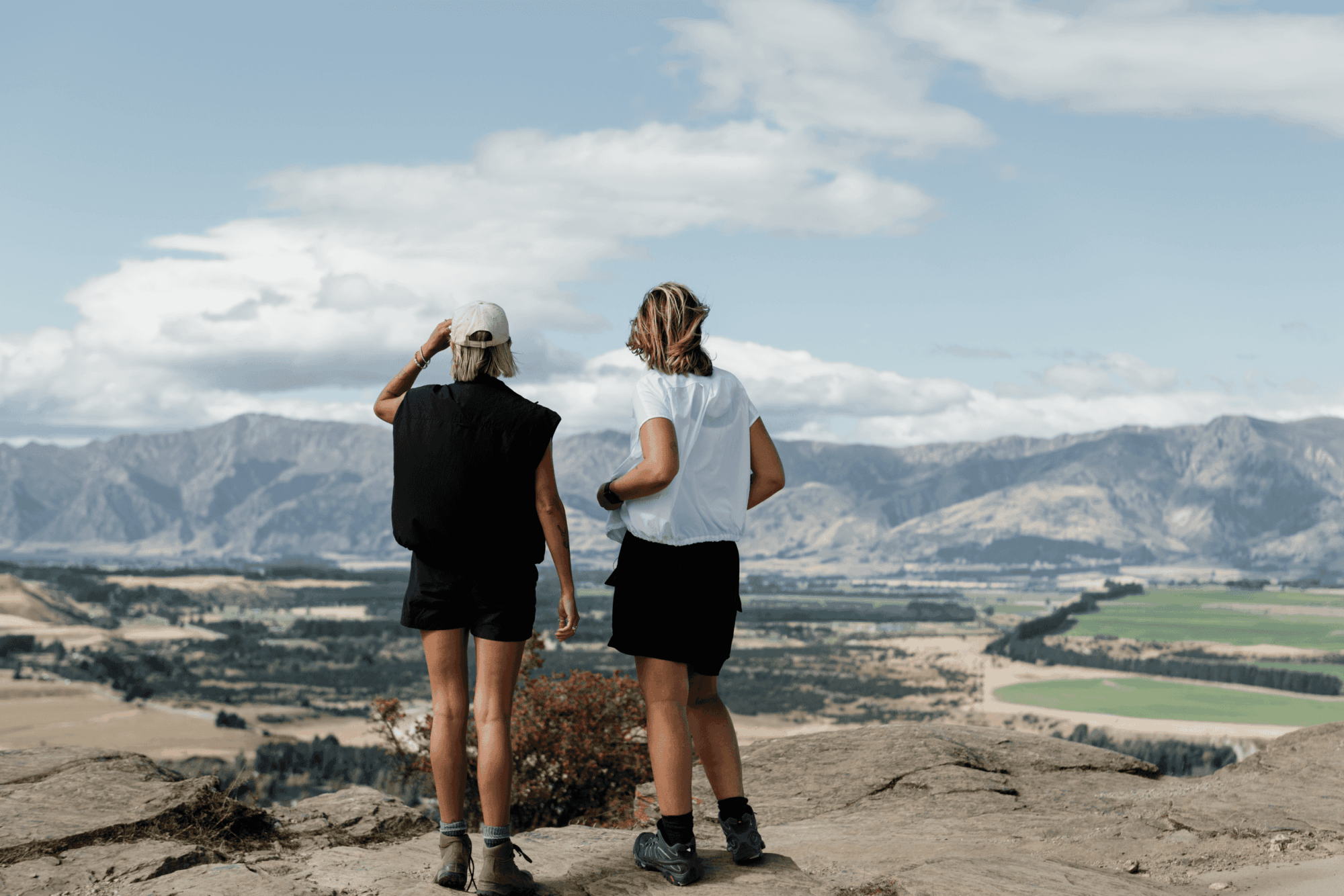 Budget friendly accommodation Wānaka - Two people walking the Mt Iron track